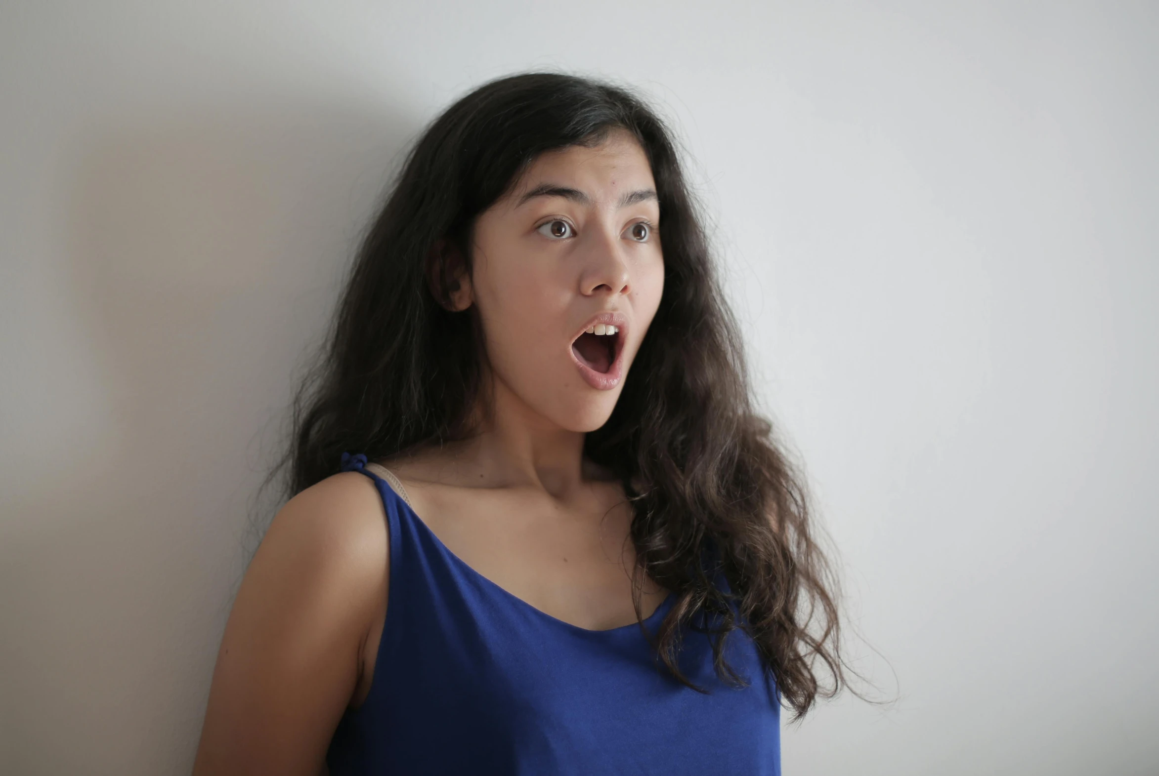 a woman with a surprised look on her face, pexels contest winner, <pointé pose>;open mouth, gongbi, alanis guillen, h3h3