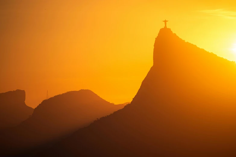 a cross on top of a mountain at sunset, pexels contest winner, romanticism, brazil carnival, avatar image