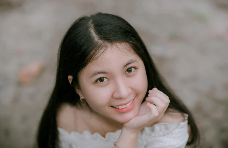 a woman in a white dress posing for a picture, inspired by Kim Jeong-hui, pexels contest winner, realism, young cute face, female with long black hair, smiling down from above, close up portrait photo