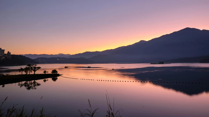 a large body of water with mountains in the background, pexels contest winner, land art, early dawn, chiba prefecture, whistler, in a row