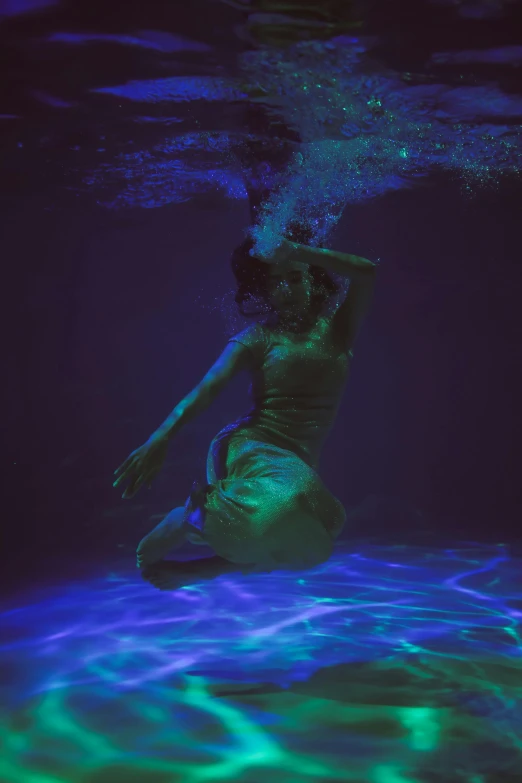 a man dives under water in a pool, an album cover, inspired by Elsa Bleda, purple and blue neon, ignant, brooke shaden detailed, fanart