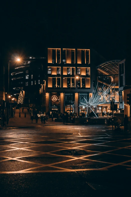 a street filled with lots of lights next to tall buildings, in a square, high-quality photo, square, vivid image