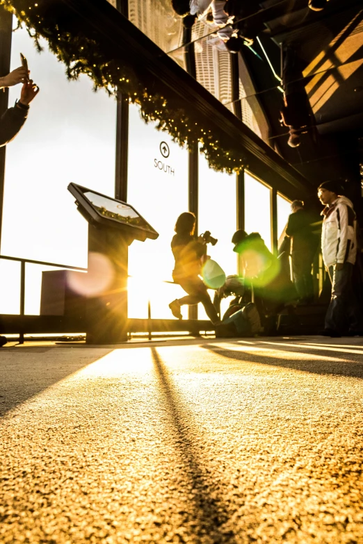 a man flying through the air while riding a skateboard, a picture, by Sebastian Spreng, happening, sunrise coloring the room, group of people in an elevator, the sun is shining. photographic, kneeling at the shiny floor