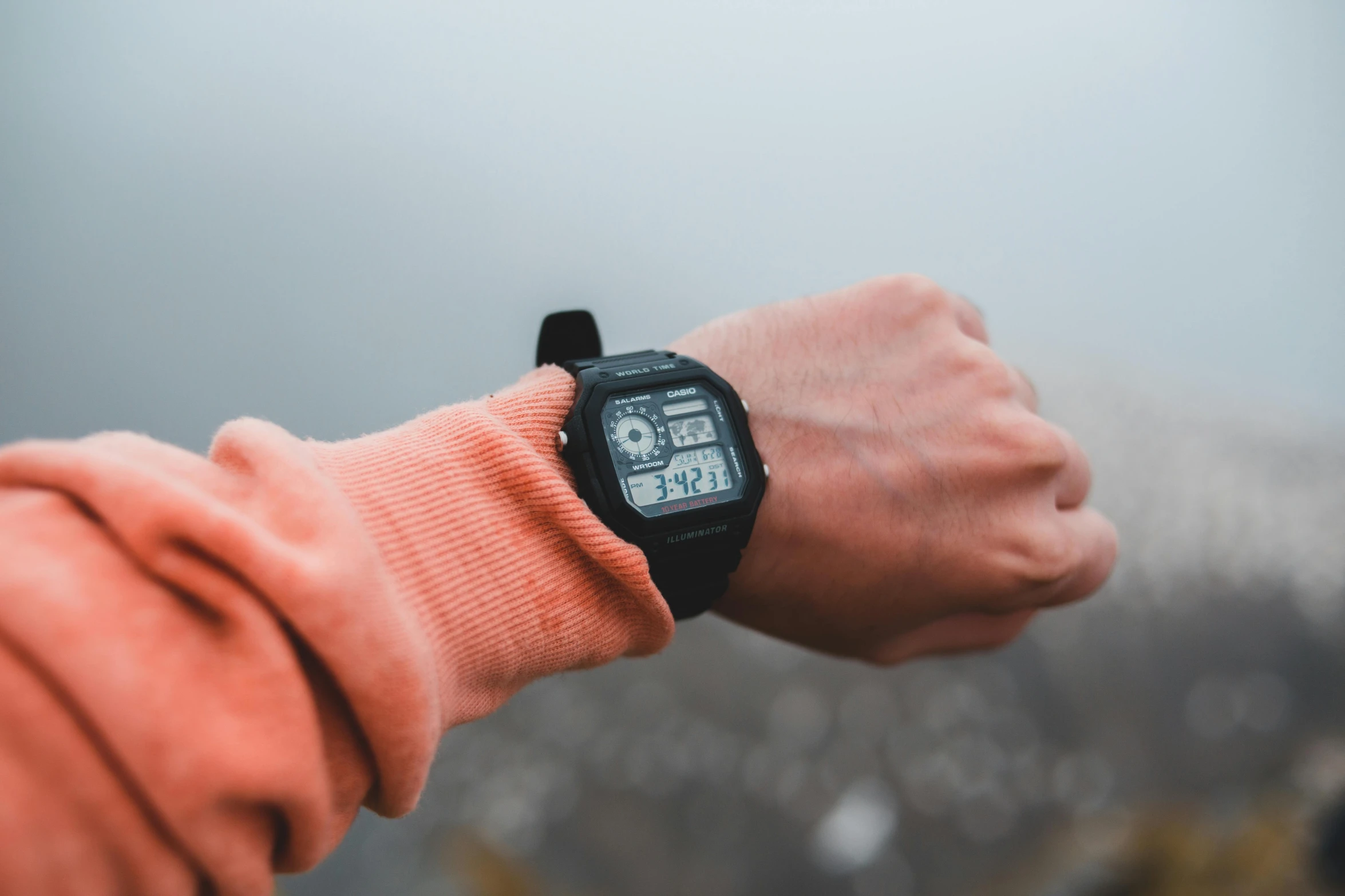 a close up of a person wearing a watch, a picture, by Adam Marczyński, pexels, hiking clothes, videogame still, overcast weather, 🦩🪐🐞👩🏻🦳
