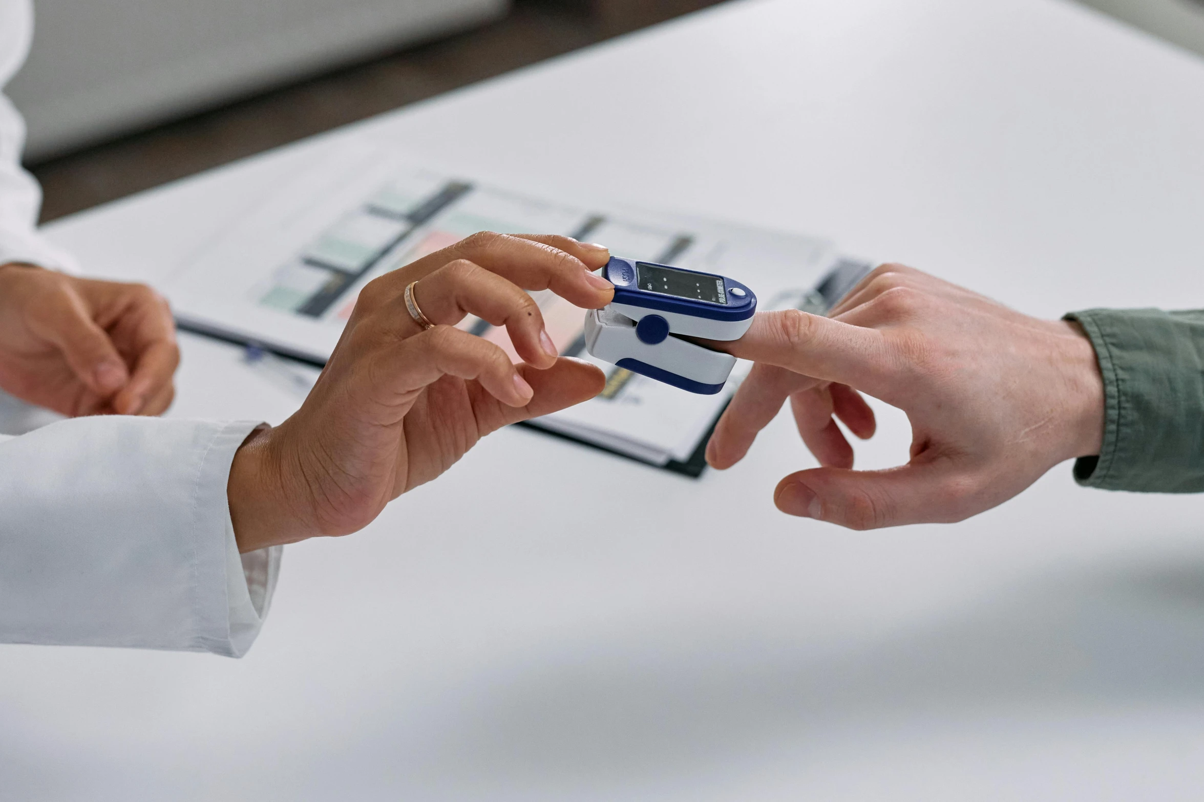 a close up of a person holding a cell phone, medical equipment, on a table, profile image, thumbnail