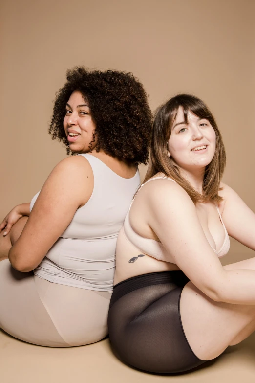 a couple of women sitting next to each other, silicone skin, rubenesque, supportive, not wearing many clothes