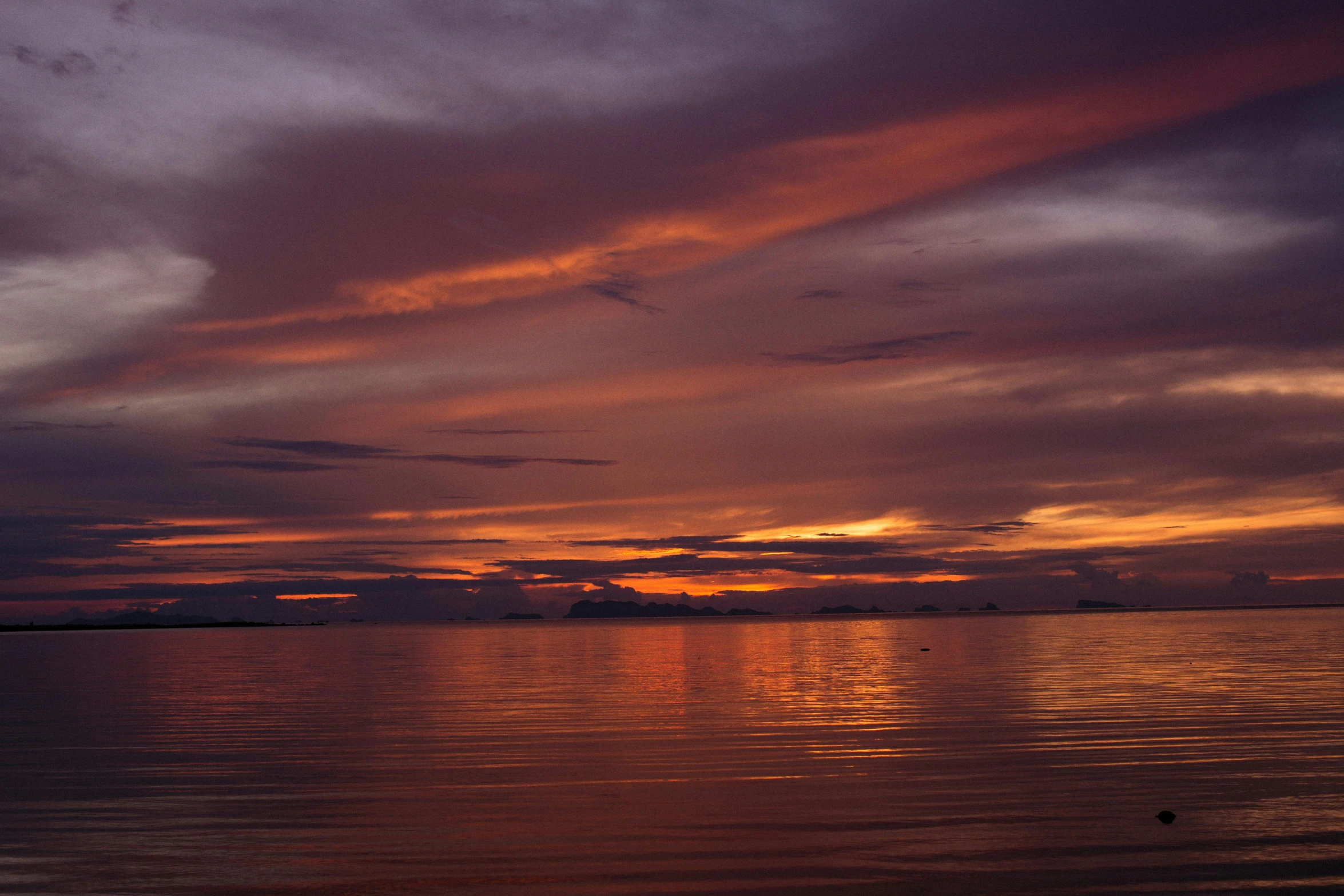 a large body of water with a sunset in the background, by Jan Tengnagel, sumatraism, fan favorite, red hues, album, calm seas