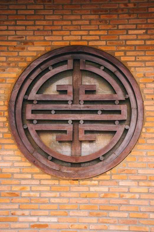 a red fire hydrant sitting in front of a brick wall, cloisonnism, enso, wooden decoration, round-cropped, hangzhou