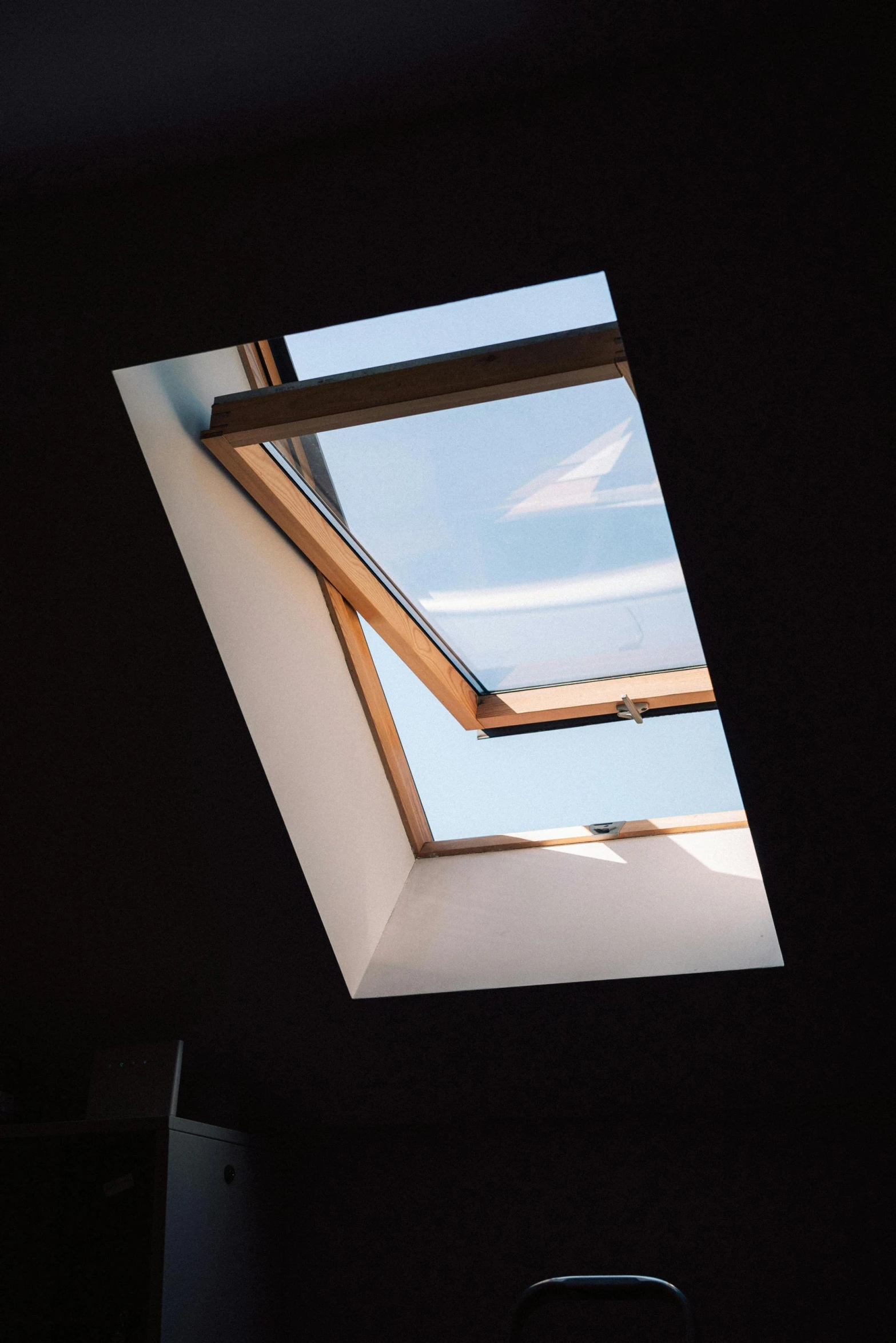 a view of a skylight in a dark room, neighborhood outside window, immaculate shading, clear skies, glowy light