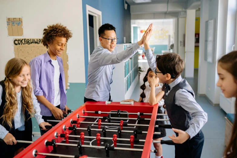 a group of people standing around a foo foo foo foo foo foo foo foo foo foo foo, pexels contest winner, american barbizon school, gaming table, celebrate goal, 15081959 21121991 01012000 4k, families playing