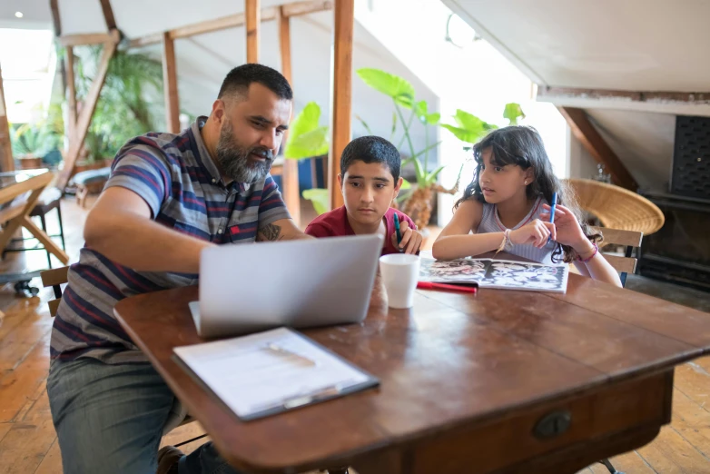 a man and two children sitting at a table with a laptop, pexels contest winner, ashcan school, avatar image, high quality photo, te pae, islamic