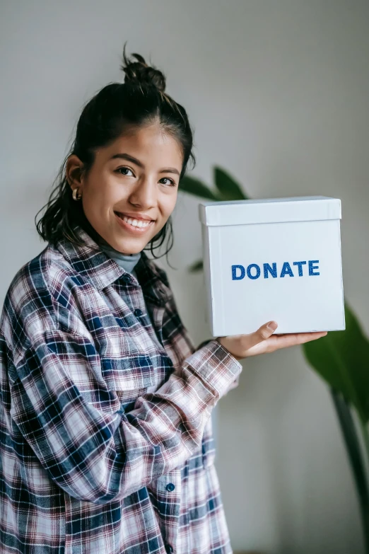 a woman holding a donation box, an album cover, pexels contest winner, white, 2 0 2 2 photo, teenager, small