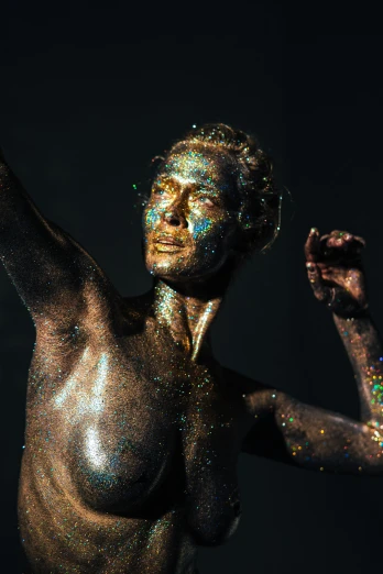 a close up of a person with glitter on their body, a statue, holography, playful pose of a dancer, ignant, pigment, standing triumphant and proud