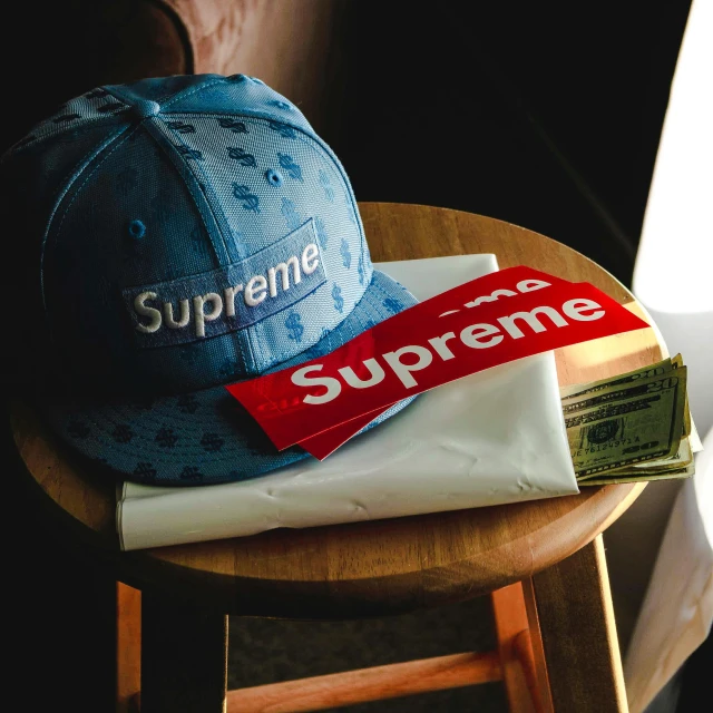a hat sitting on top of a wooden stool, unsplash, graffiti, supreme pizza, ((blue)), expensive, skincare