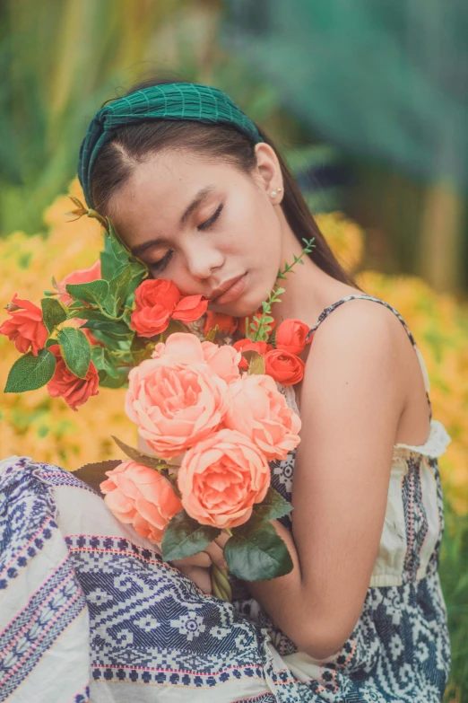 a woman sitting on the ground holding a bouquet of flowers, inspired by Oleg Oprisco, unsplash, asleep, vietnamese woman, laying on roses, full frame image