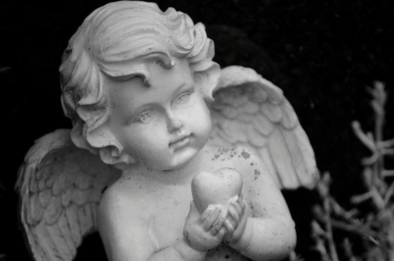 a statue of an angel holding an apple, inspired by Margaret Brundage, pexels, black and white color only, small heart - shaped face, innocent look, hands