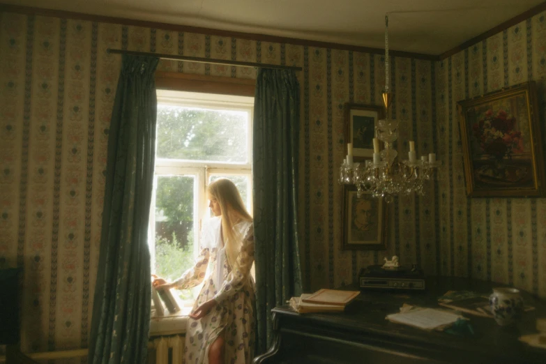 a woman standing in front of a window, an album cover, unsplash, romanticism, hammershøi, hunting, still from film, midsummer