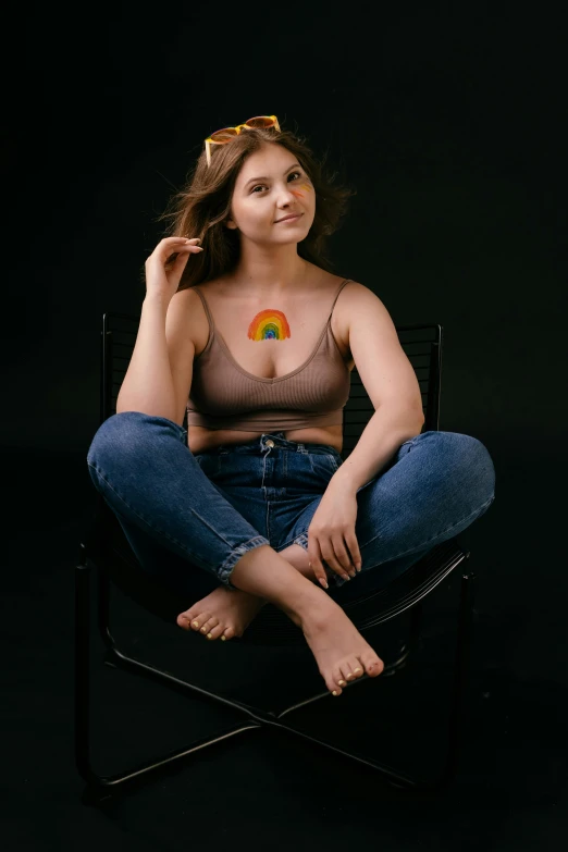 a woman sitting in a chair with a rainbow painted on her chest, trending on pexels, renaissance, wearing a low cut tanktop, wearing a brown, adafruit, product introduction photo