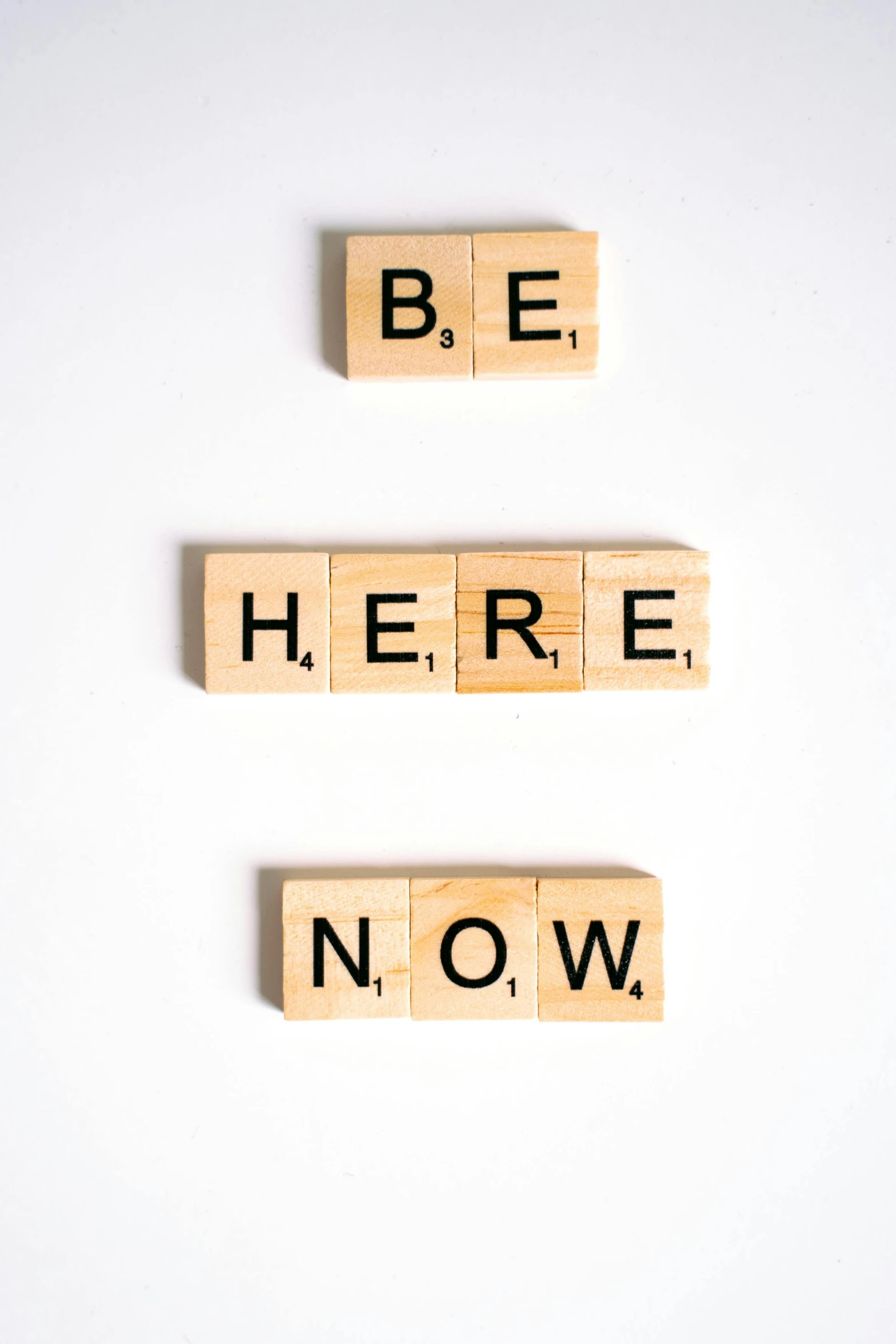 wooden blocks spelling be here now on a white background, by Bernie D’Andrea, trending on unsplash, trending on society6, 2 0 2 2 photo, inspirational arthouse, 8 l