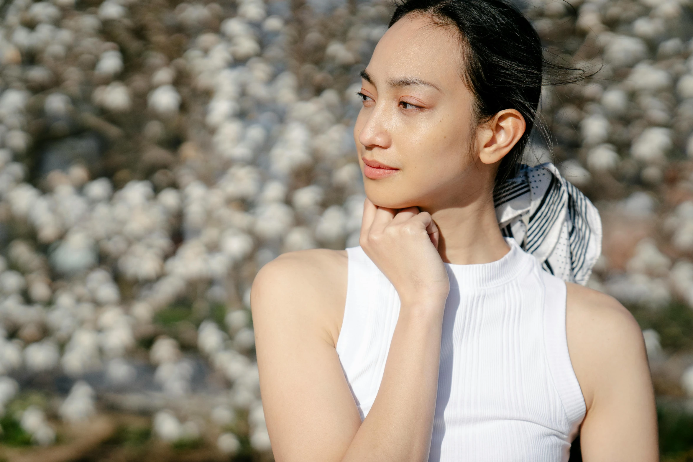 a woman with a bird on her head, inspired by Dai Xi, trending on pexels, shin hanga, sleeveless turtleneck, white blossoms, sydney park, ethnicity : japanese
