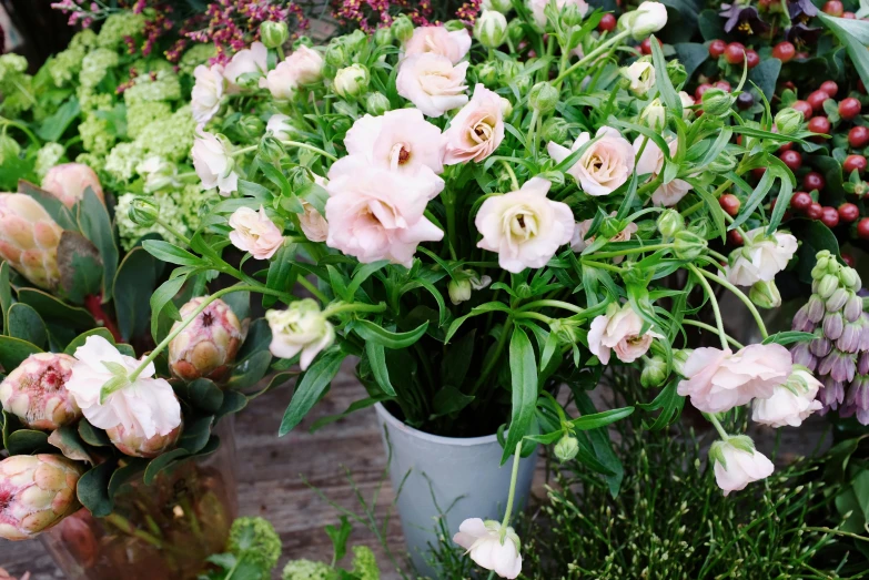 a bunch of flowers that are in a vase, a pastel, inspired by Pierre-Joseph Redouté, unsplash, light pink mist, large potted plant, in a cottagecore flower garden, a wide full shot