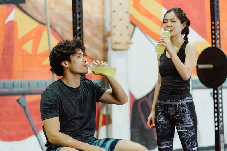 a man and a woman drinking water in a gym, by Natasha Tan, profile image, lee griggs and jason chan, background image, al fresco