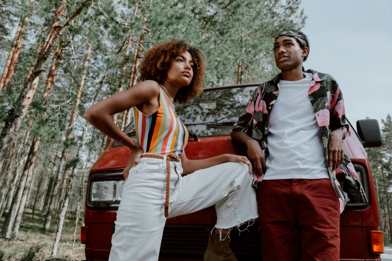 a man and a woman standing next to a red truck, trending on pexels, afro-psychedelia, casual summer clothes, leather clothing, avatar image