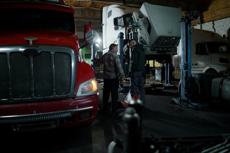 a couple of men standing next to a red truck, cinematic industrial lighting, inspect in inventory image, shot with sony alpha 1 camera, mechanic