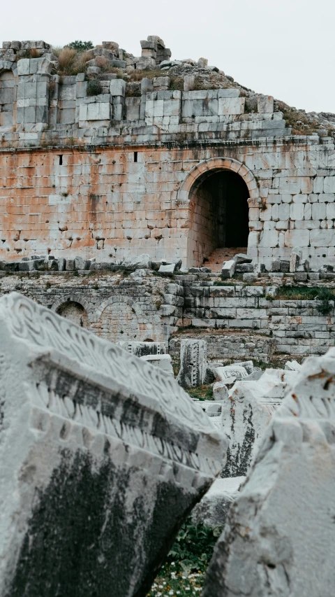 a couple of large rocks sitting next to each other, unsplash contest winner, neoclassicism, inside the roman colliseum, torri gate, low quality photo, theater