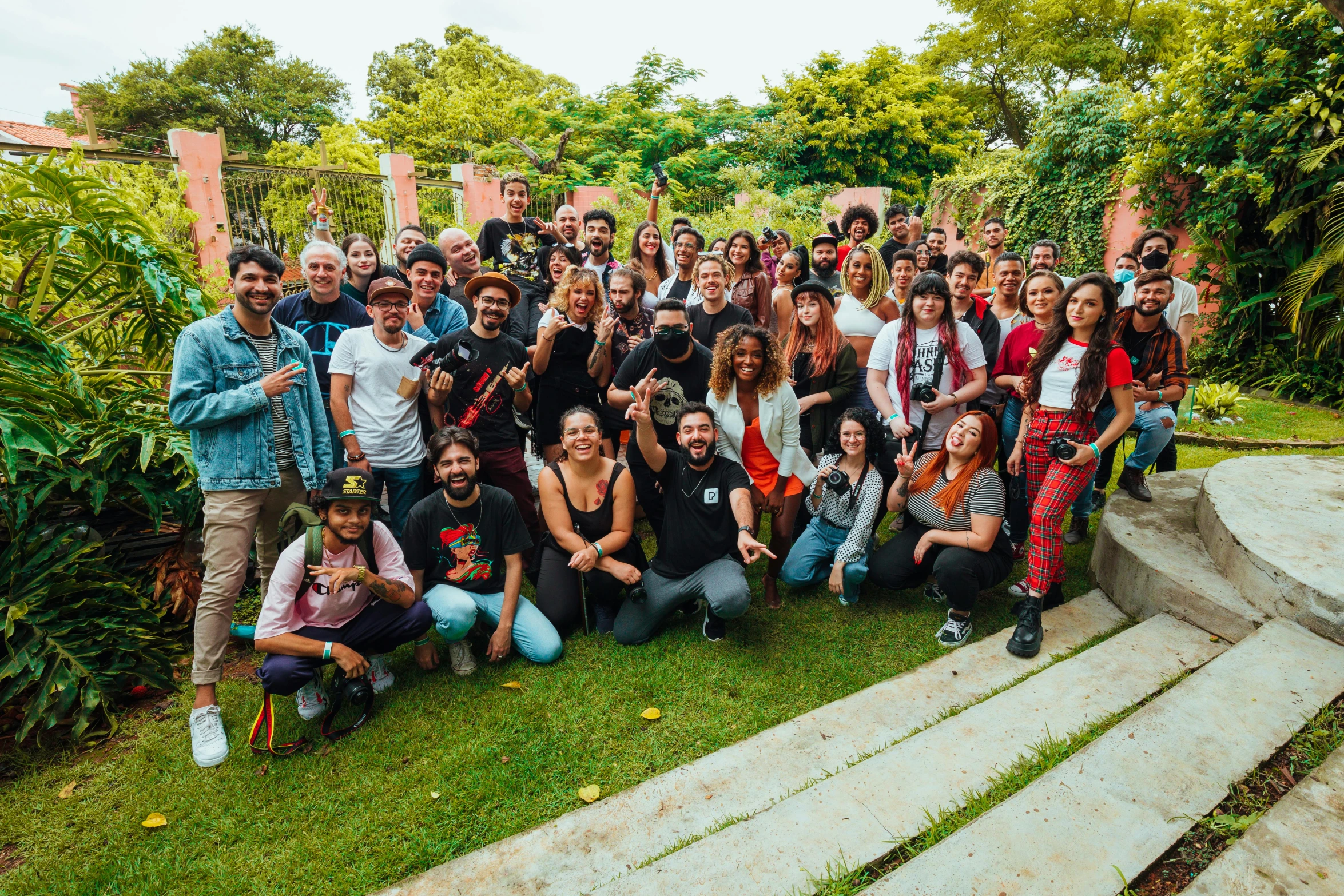 a group of people posing for a picture, by Samuel Silva, junglecore, sao paulo, group photo, full daylight