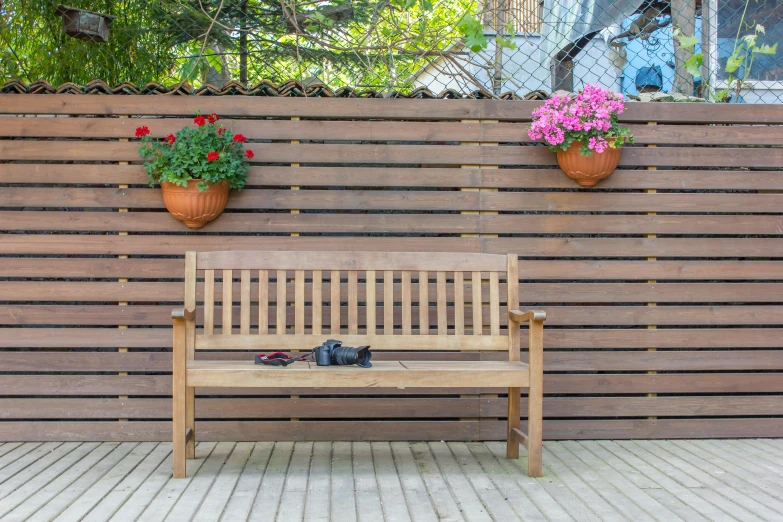 a wooden bench sitting on top of a wooden floor, inspired by Constantin Hansen, garden with flowers, full width, full product shot, fencing