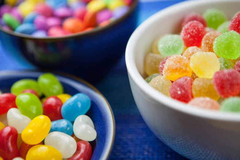 a bowl of jelly beans next to a bowl of jelly beans, trending on pexels, blue, 2 5 6 x 2 5 6 pixels, fruit machines, close up portrait shot