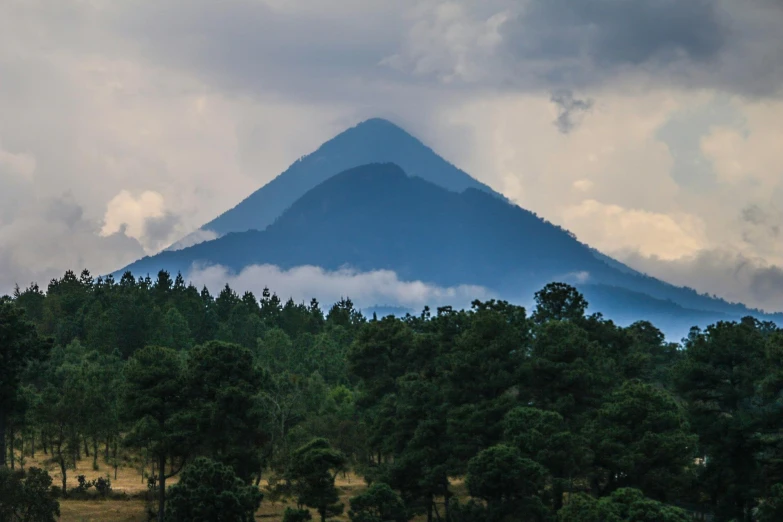 a mountain in the distance with trees in the foreground, by Alejandro Obregón, pexels contest winner, mexico, avatar image, james turrell, multiple stories