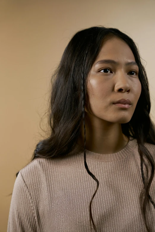 a woman holding a cell phone up to her ear, a character portrait, inspired by Kim Tschang Yeul, trending on pexels, hyperrealism, he is wearing a brown sweater, serious focussed look, mid long hair, inuit