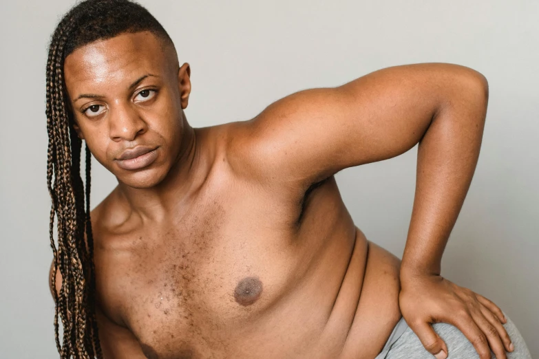 a man with no shirt on posing for a picture, an album cover, inspired by Sam Charles, trending on pexels, alexis franklin, non binary model, fleshy musculature, imane anys