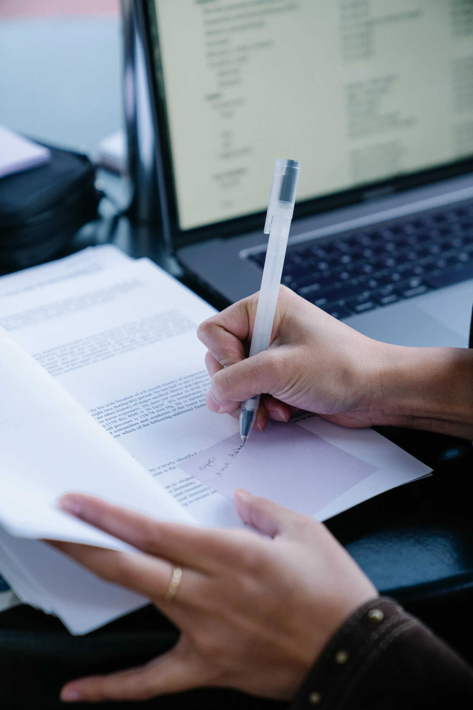 a person sitting at a desk with a laptop and a pen, official documentation, behance lemanoosh, getty images, selling insurance