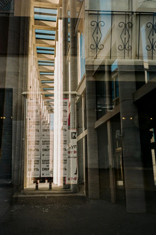 a man riding a skateboard down a street next to tall buildings, inspired by Ricardo Bofill, light and space, roman columns, shopwindows, mirror hallways, national gallery