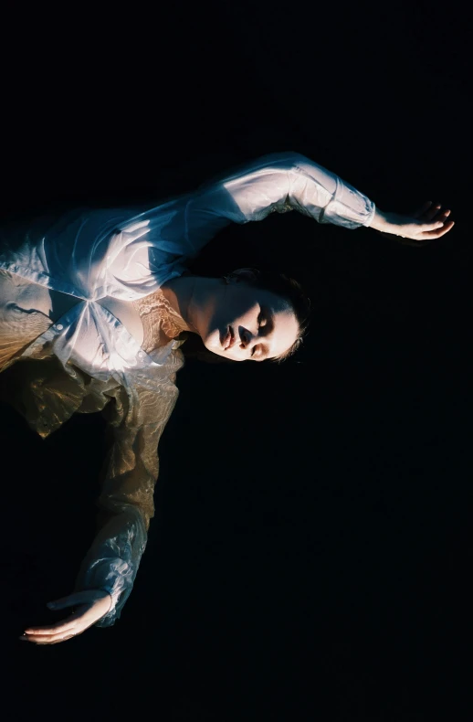 a man flying through the air while riding a skateboard, a portrait, by Elizabeth Polunin, art photography, portrait of a woman underwater, arca album cover, ( low key light ), ignant