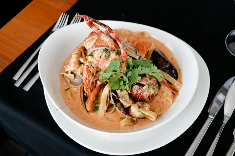 a close up of a plate of food on a table, crustacean, pasta, tamborine, creamy