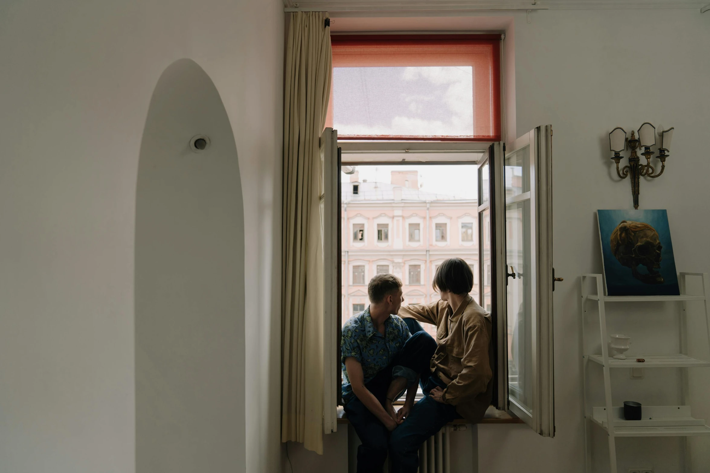 a man and a woman sitting on a window sill, by Attila Meszlenyi, pexels contest winner, arte povera, city apartment cozy calm, maurizio cattelan, standing in corner of room, gay