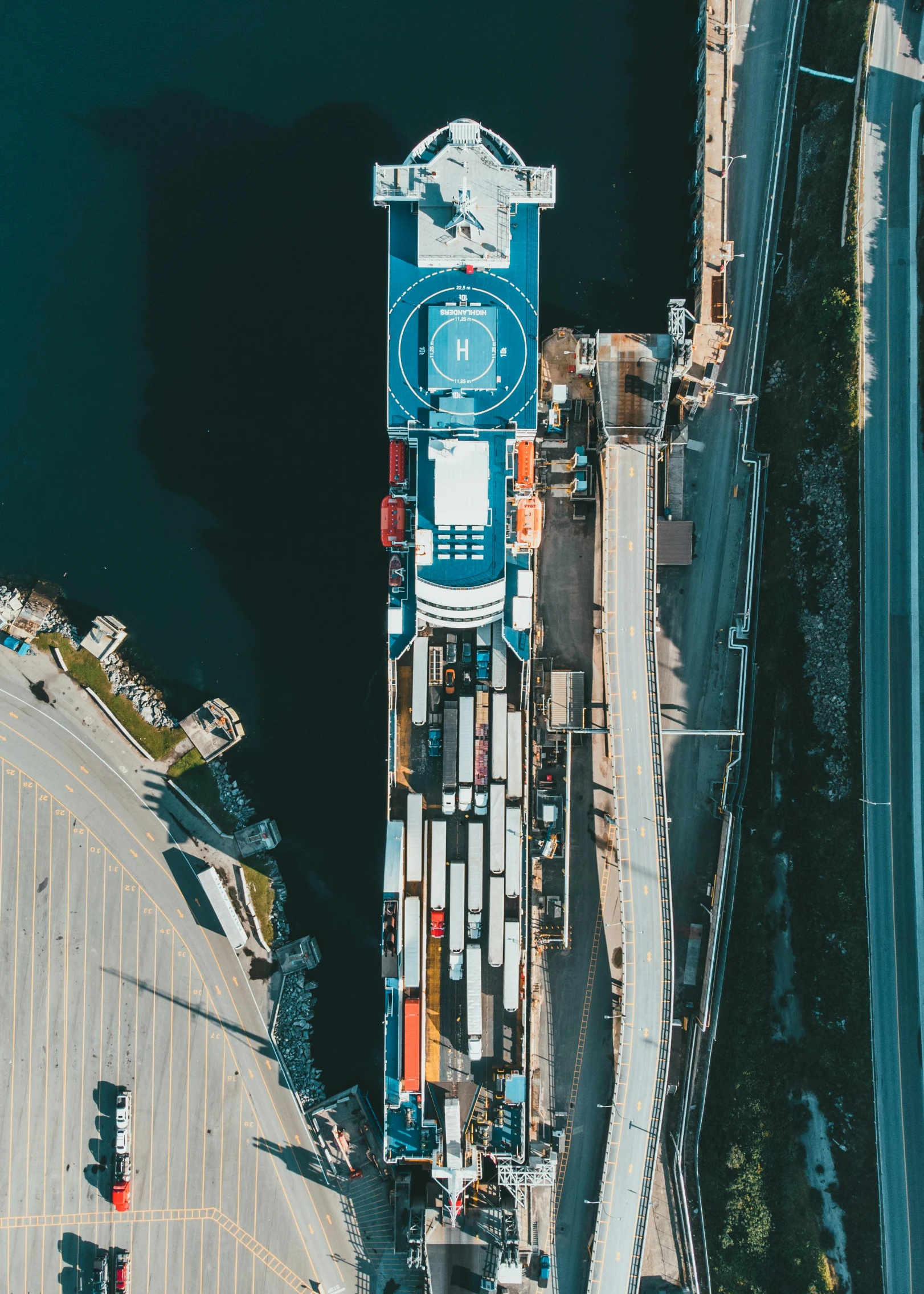 a large container ship sitting on top of a body of water, poster art, by Sam Black, pexels contest winner, happening, high angle security camera feed, docked at harbor, 1 petapixel image, built on a small