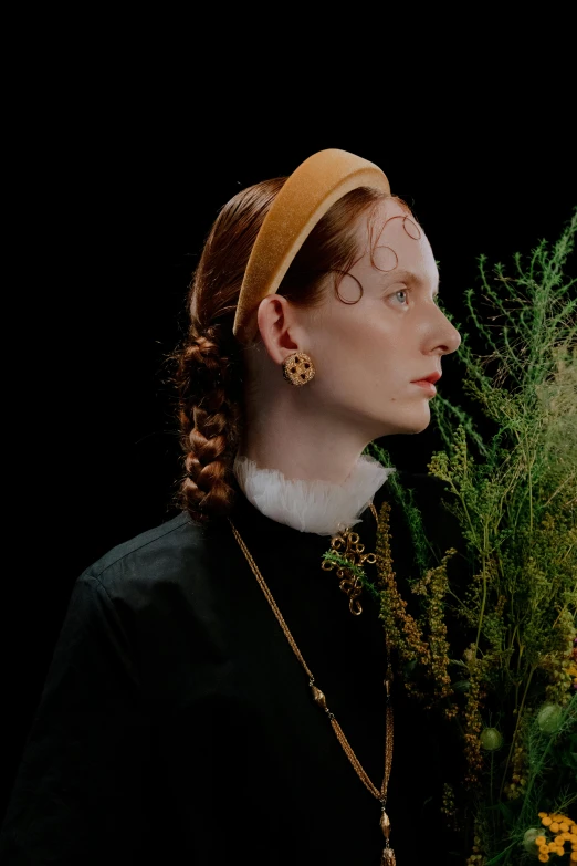 a woman standing in front of a bunch of flowers, an album cover, inspired by Lucas Cranach the Elder, trending on pexels, earring, studio portrait, sansa, golden circlet