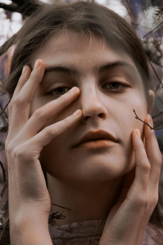 a woman with her hands on her face, a photorealistic painting, inspired by Elsa Bleda, trending on pexels, twigs, portrait of an insectoid, beautiful androgynous girl, transparent skin