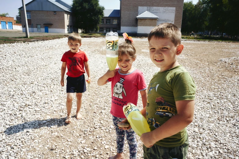 a couple of kids standing on top of a gravel field, danube school, lemonade, photograph of three ravers, maintenance photo, summer unreal engine 5