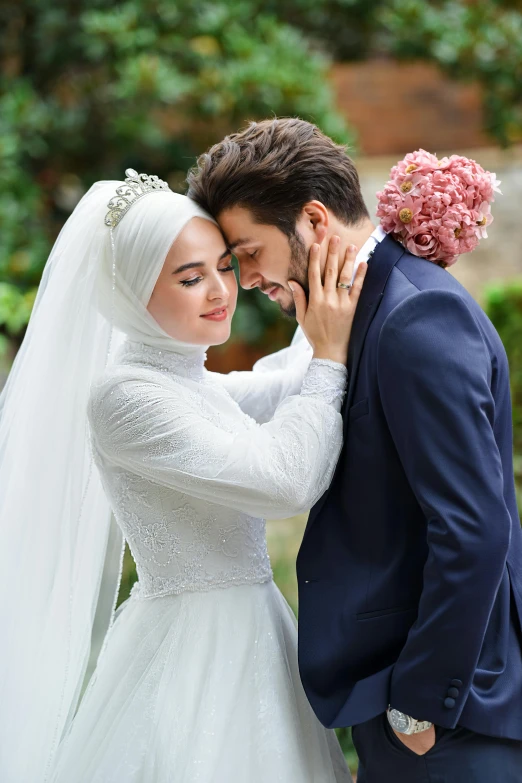 a bride and groom standing next to each other, inspired by Altoon Sultan, shutterstock, romanticism, white hijab, hugging, square, ( ( theatrical ) )