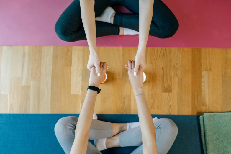 a couple of women sitting on top of a yoga mat, trending on pexels, renaissance, symmetrical hands, avatar image, coloured, high quality image