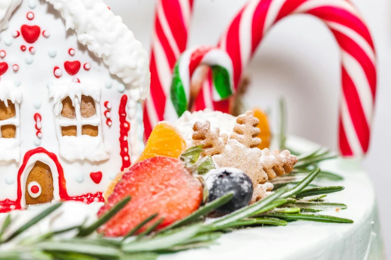 a cake decorated to look like a ginger house, a photo, pexels, candy canes, background image, healthy, white