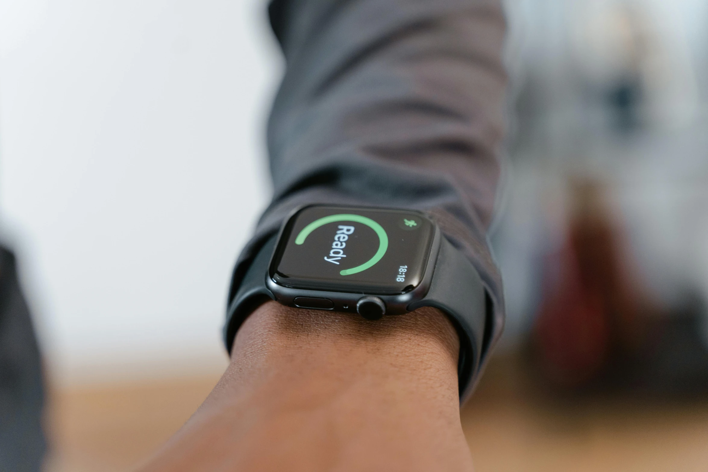 a close up of a person holding an apple watch, by Robbie Trevino, happening, about to step on you, full body hero, square, at home