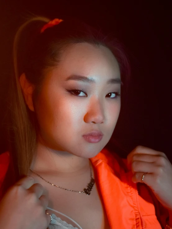 a woman in an orange jacket posing for a picture, an album cover, inspired by Xia Chang, unsplash, realism, 🤤 girl portrait, bbwchan, evening lighting, 2 3 years old