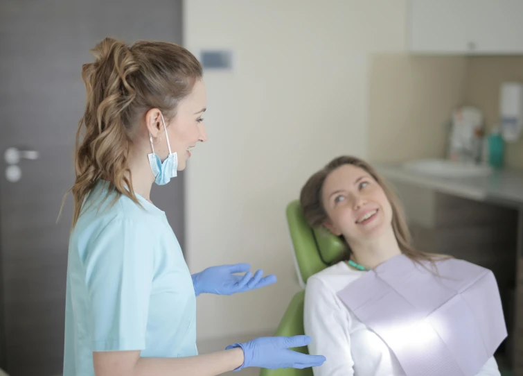 a woman sitting in a chair next to a woman in a dentist's chair, pexels contest winner, happening, profile image, uniform teeth, low quality photo, thumbnail
